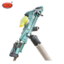 Hand operated pneumatic rock drill